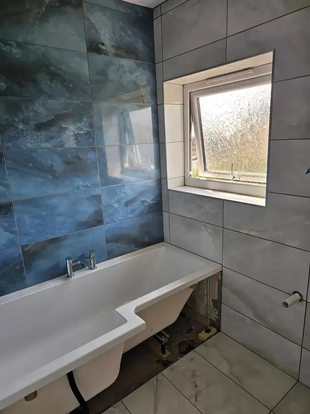 Bathroom tiling in Swansea: blue white 600x300