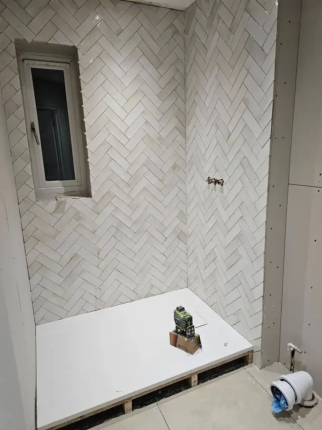 Bathroom tiling in Swansea: herringbone
