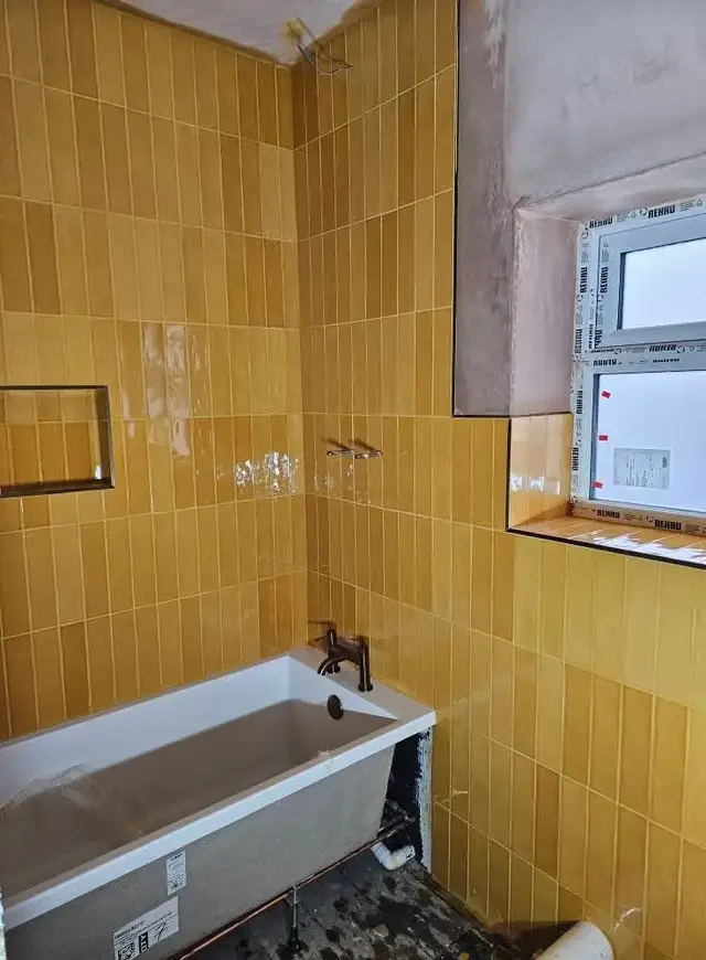 Bathroom tiling in Swansea: mustard tiles small
