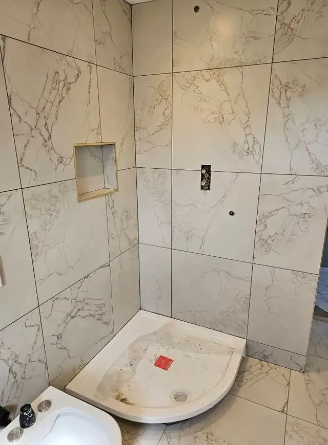 Bathroom tiling in Swansea: white pattern small shelf