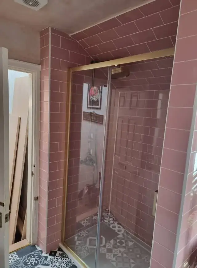 Bathroom tiling in Swansea: pink brink white grout